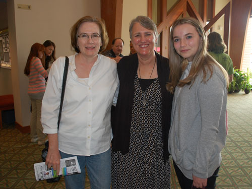 Board member with daughter attend Parish Visit